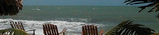 Beach chairs on the beach on the Placencia Peninsula