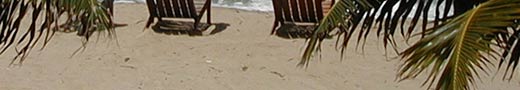 Beach chairs on the beach on the Placencia Peninsula