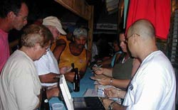 Registration for the Fishing Tournament Friday evening in front of the Placencia Tourist Information